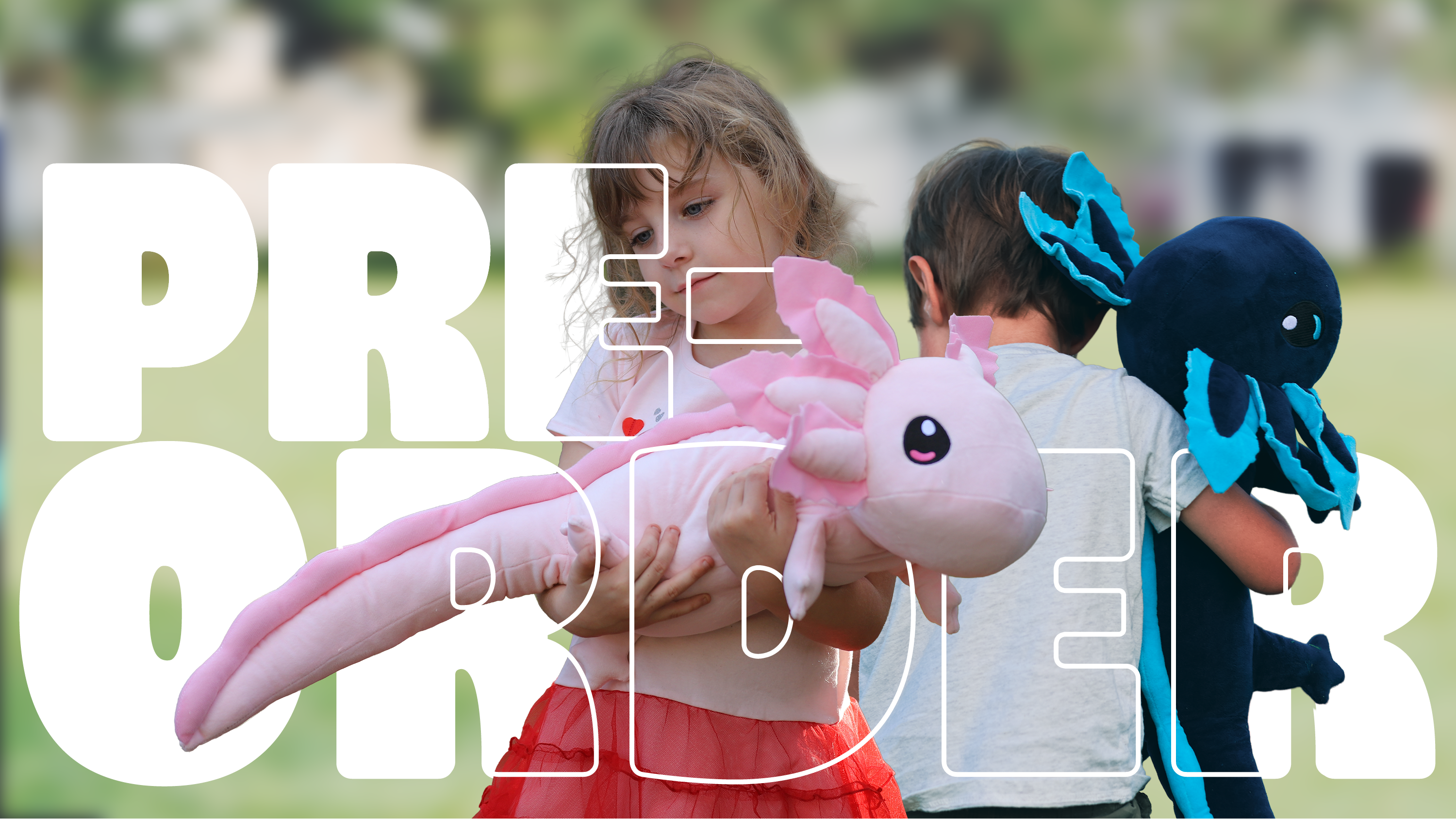 Two children outdoors holding plush axolotl toys, with a large white 'PREORDER' text overlay covering the front of the photo.
